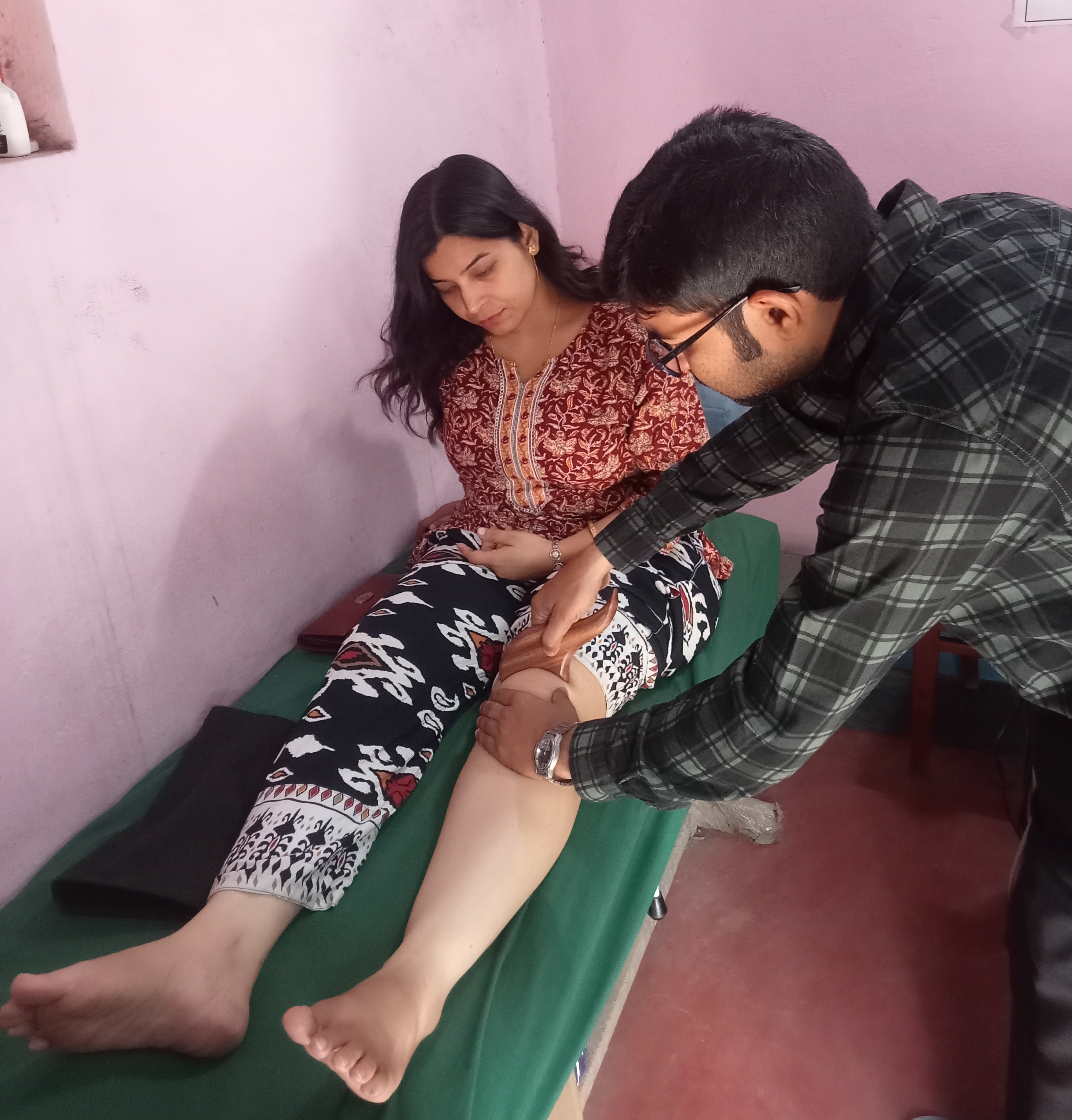 Physiotherapist treating patient
